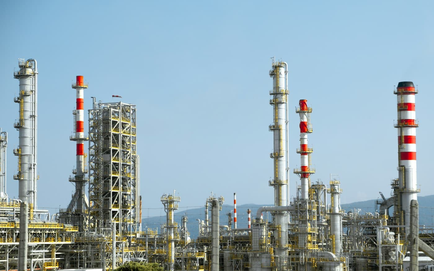 Process plant towers against a clear sky